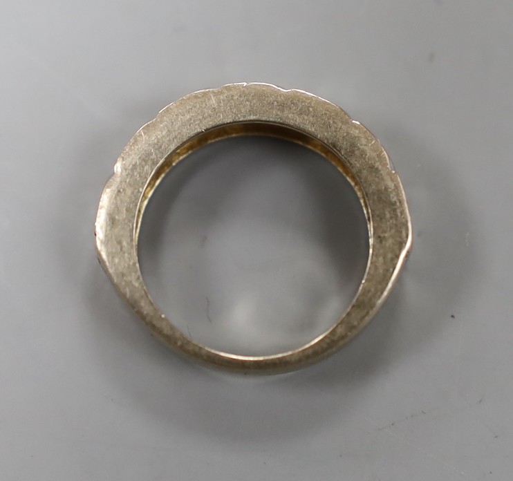 A modern 18ct white gold and seven stone diamond set half hoop ring, size J/K, gross weight 5.8 grams